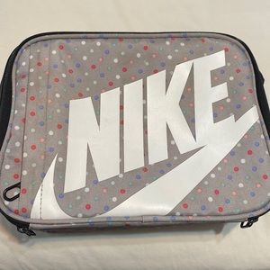 Nike lunch box used only a couple of times. Hard liner in side, extra pouch.